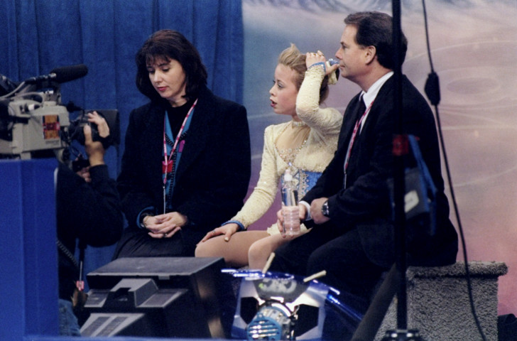 Figure skating coach Richard Callaghan, pictured right with Tara Lipinski at the 1998 US Championships, has been suspended following the re-investigation of charges of sexual misconduct made by male skaters in 1999 ©Getty Images