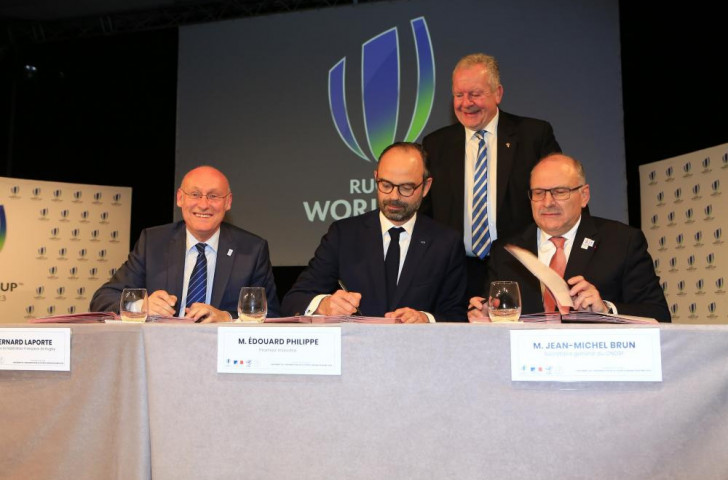 FFR President Bernard Laporte, French Prime Minister Edouard Philippe and CNOSF secretary general Jean-Michel Brun inaugurate the France 2023 Organisng Committee with World Rugby chairman Bill Beaumont behind ©FFR 

