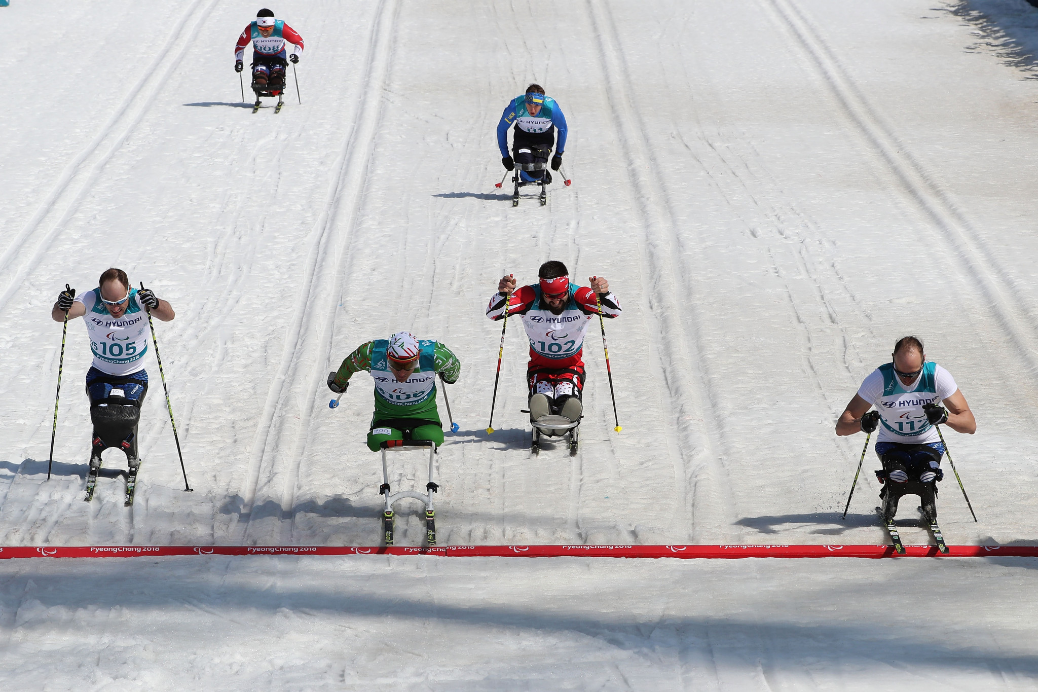 Andrew Soule, far right, required a photo finish to decide his 1.1km cross-country sitting title at the Alpensia Biathlon Cente ©Getty Images