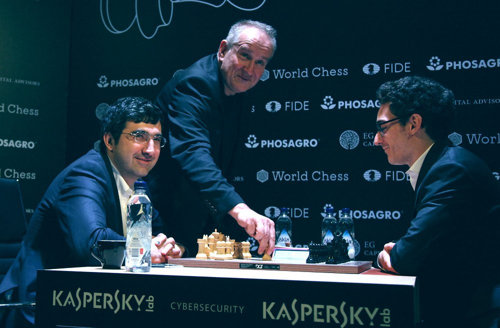 American Fabiano Caruana, right, retained top spot after drawing with Sergey Karjakin ©FIDE