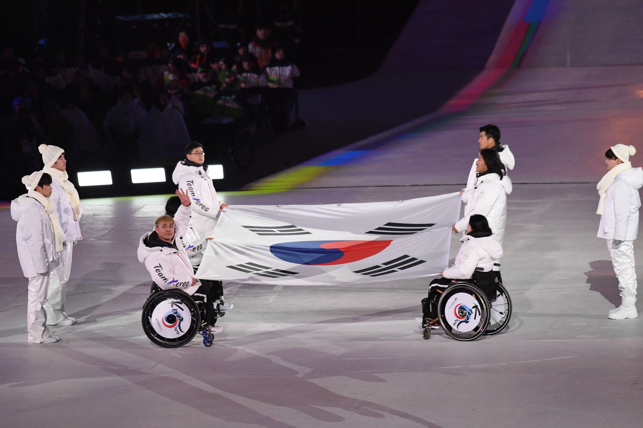 Six South Korean athletes, representing the half dozen sports at the Games, brought the host country's flag into the Pyeongchang Olympic Stadium ©Getty Images