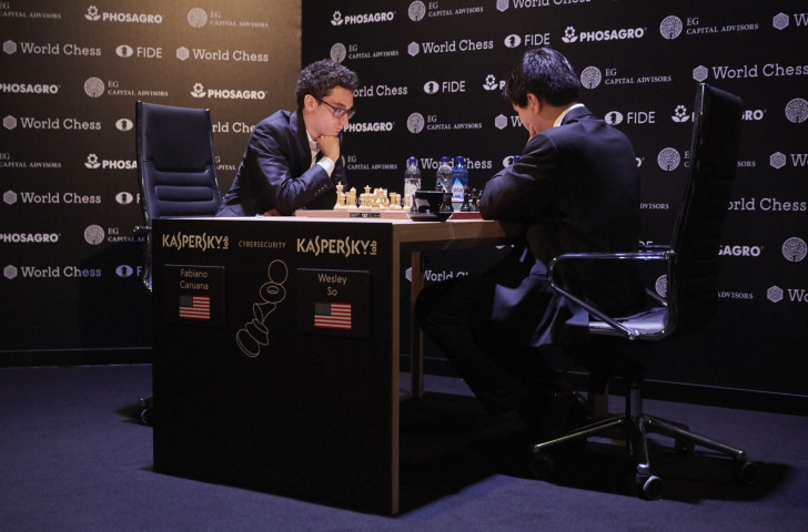 Fabiano Caruana, left, pictured playing US colleague Wesley So, is narrowly ahead in the FIDE Candidates Trophy in Berlin ©Getty Images
