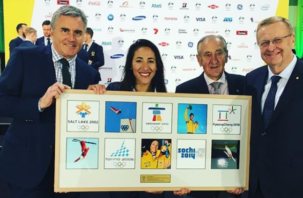 Lydia Lassila, second left, received a special plaque honouring her achievements ©AOC