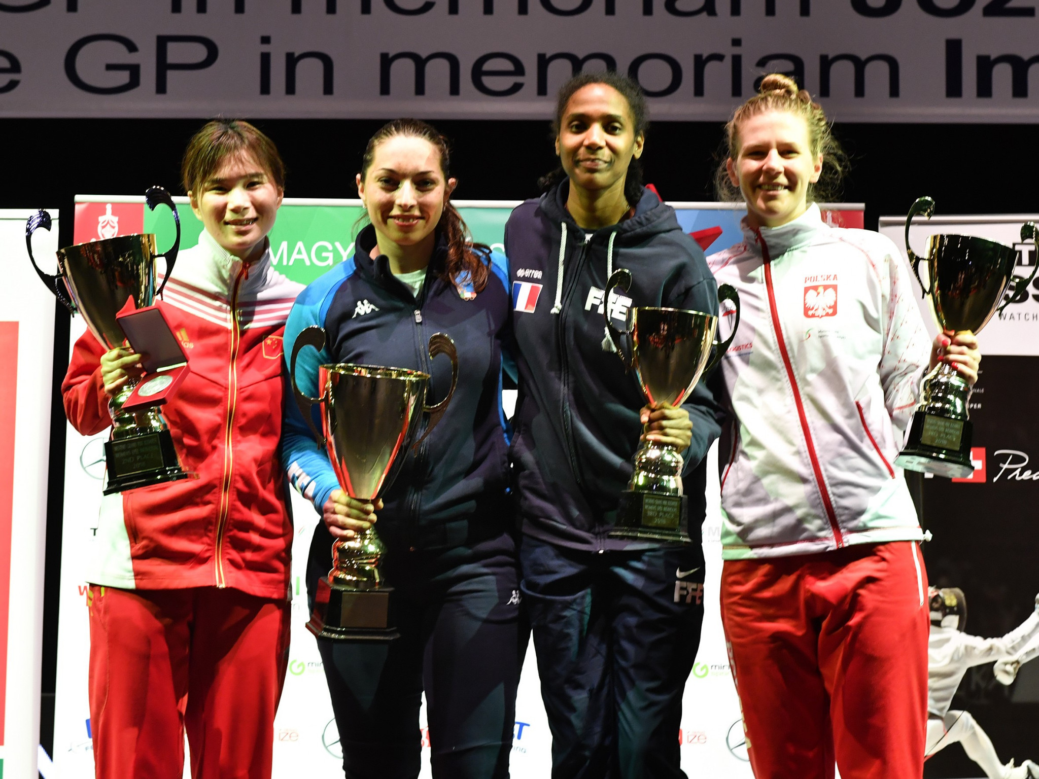 Mara Navarria of Italy, second left, won the women's title ©FIE