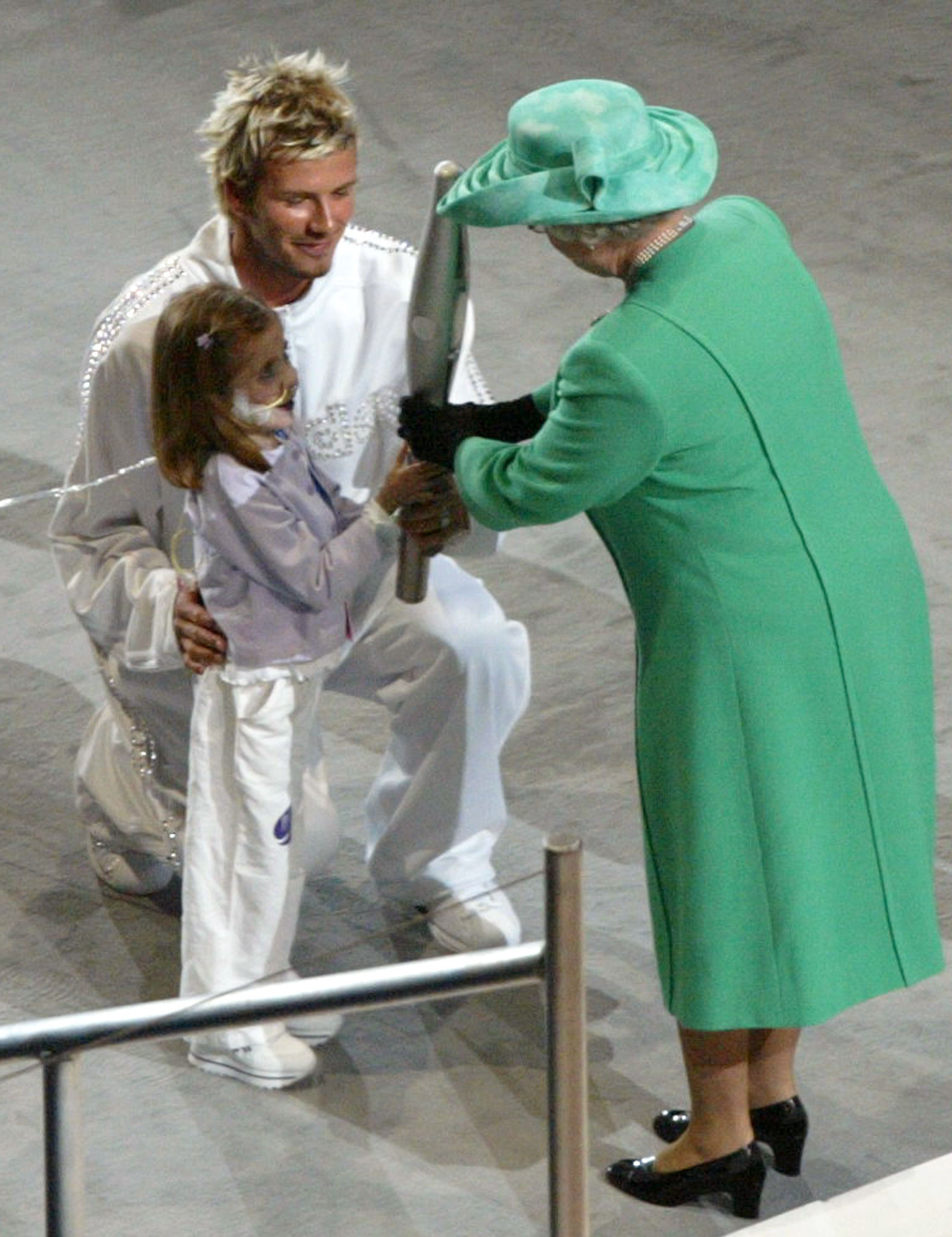 Kirsty Howard was joined by Manchester United and England footballer David Beckham to hand over the Jubilee Baton to the Queen at the Opening Ceremony of the 2002 Commonwealth Games in Manchester ©Getty Images