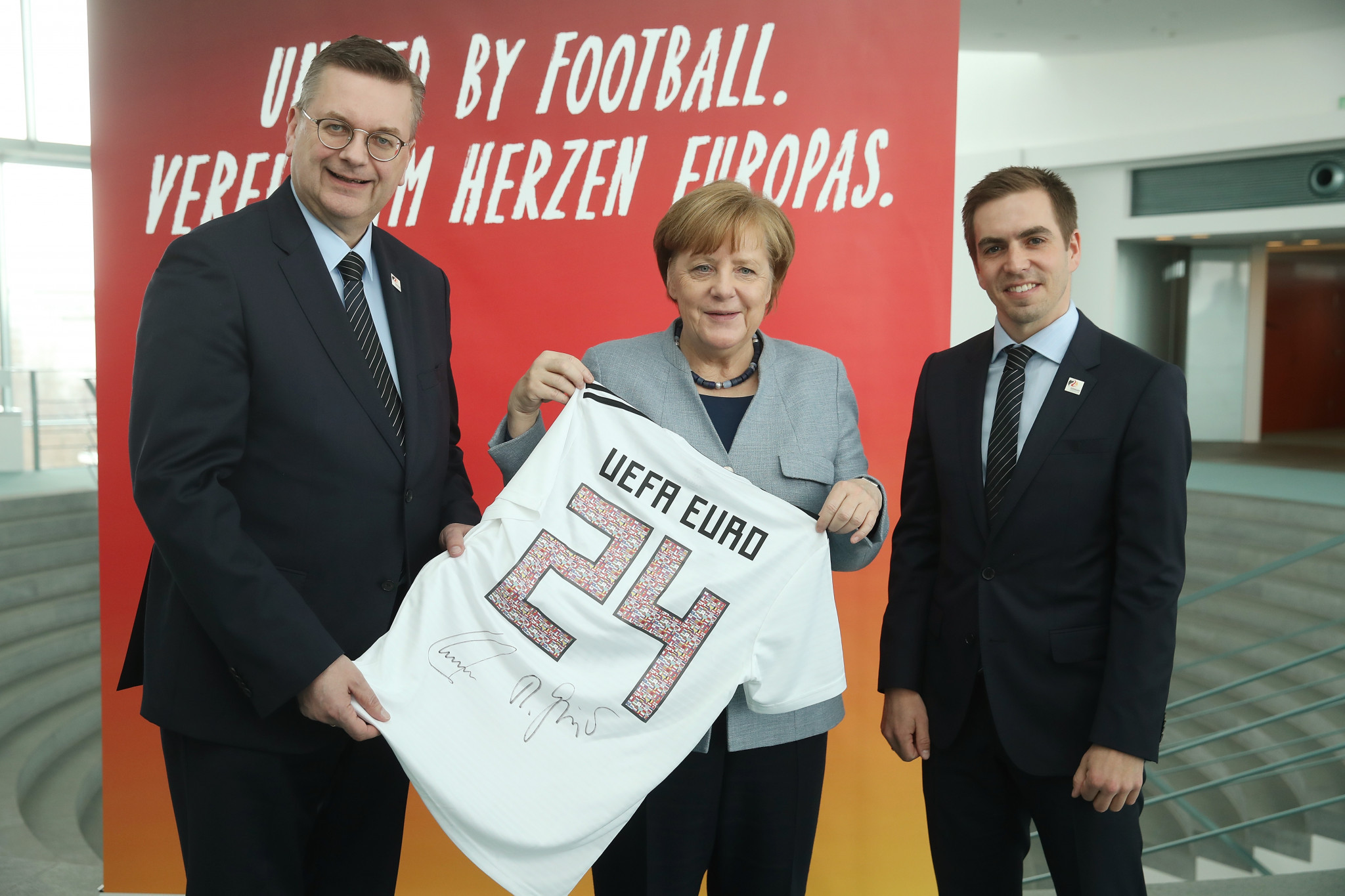Angela Merkel, centre, recently showed her support for Germany's bid for the UEFA Euro 2024 tournament ©Getty Images