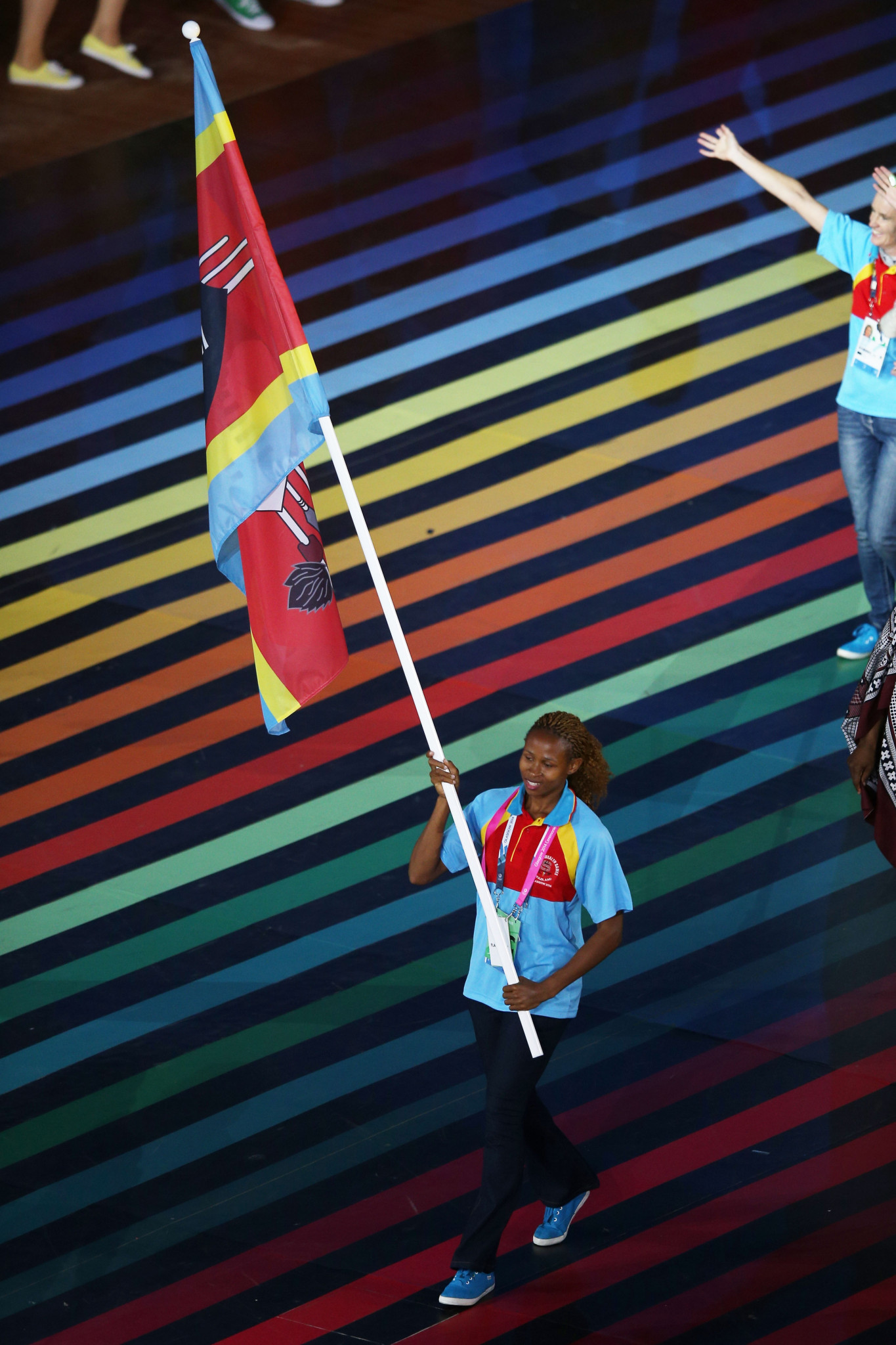 Phumlile Ndzinisa carries the Swaziland flag at the Glasgow 2014 Commonwealth Games ©Getty Images