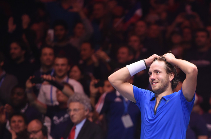 Lucas Pouille, pictured after winning the decisive match to earn France Davis Cup victory last year in Villeneuve d'Ascq, leads the team against Italy tomorrow in search of a 2018 World Group semi-final place ©Getty Images