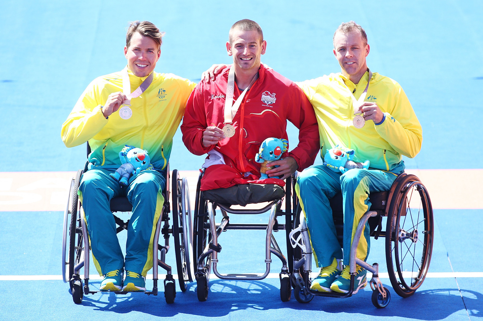 Joseph Townsend celebrates in between his fellow medal winners ©Getty Images