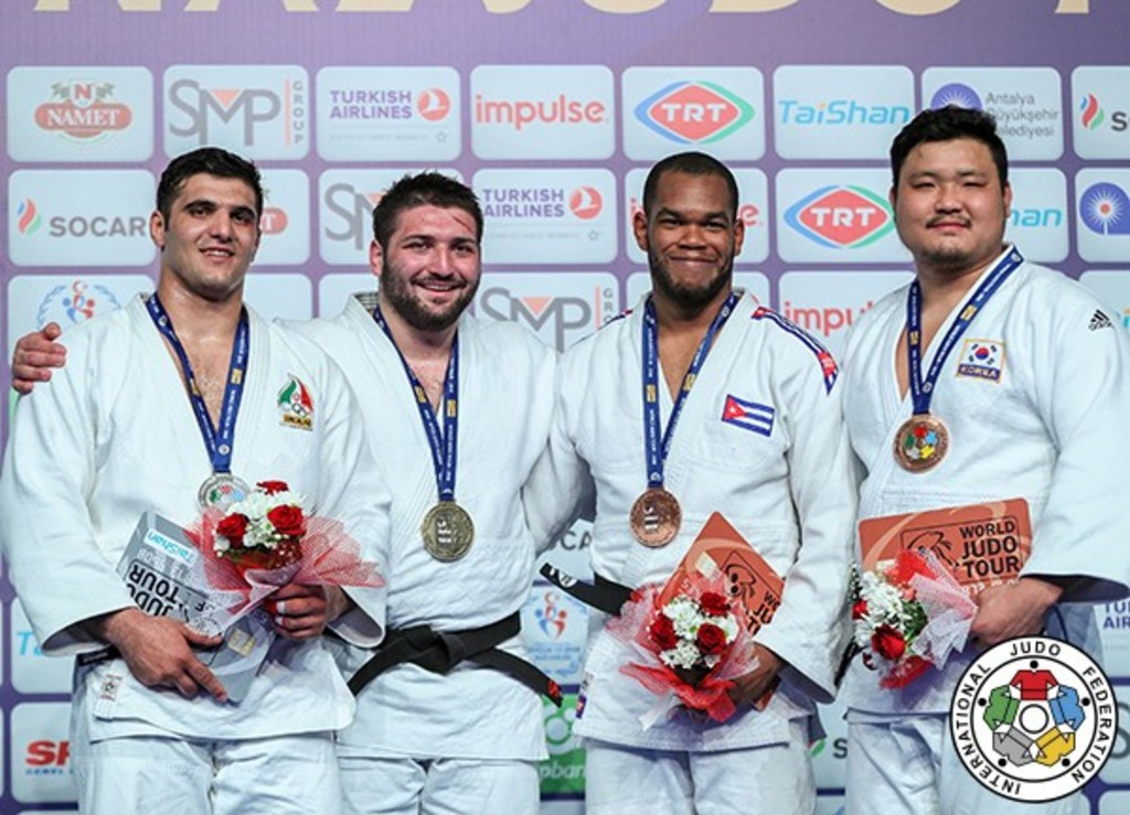 Iran’s Javad Mahjoub, second left, is richer by an IJF Grand Prix silver medal and a new daughter this week ©IJF