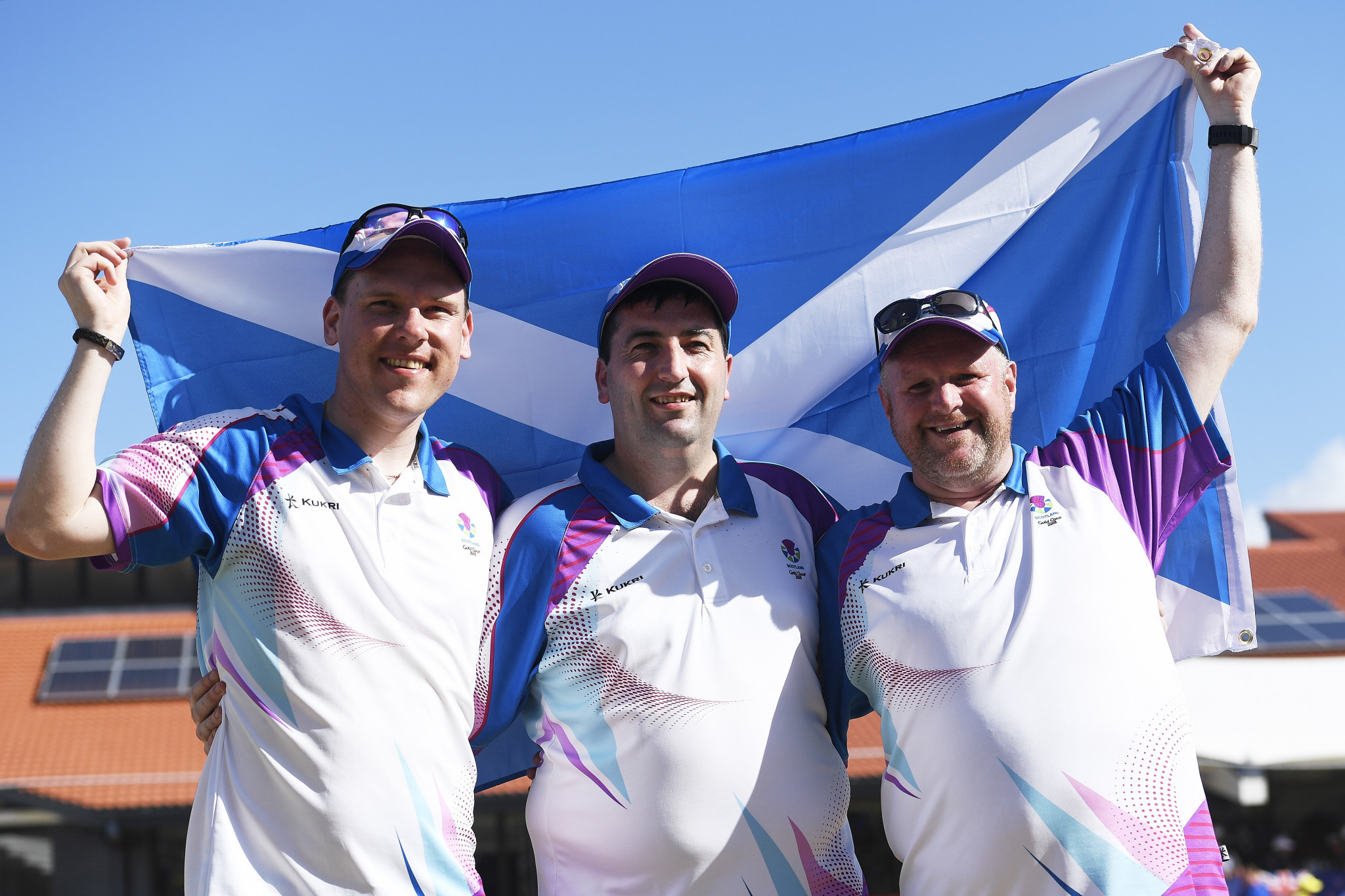 Ronald Duncan, Derek Oliver and Darren Burnett of Scotland celebrate triples success for Scotland ©Getty Images