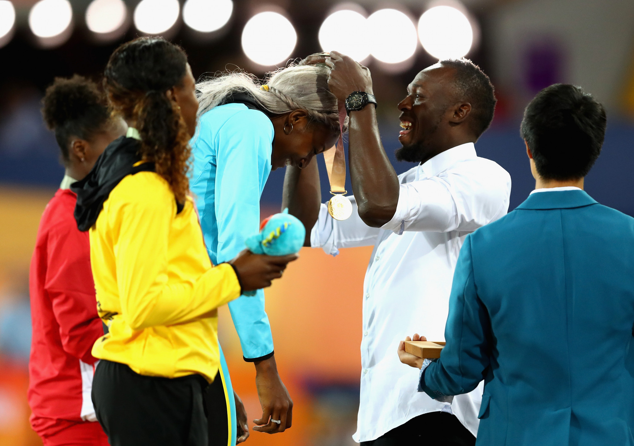 Usain Bolt presented the medals in the women's 200m ©Getty Images