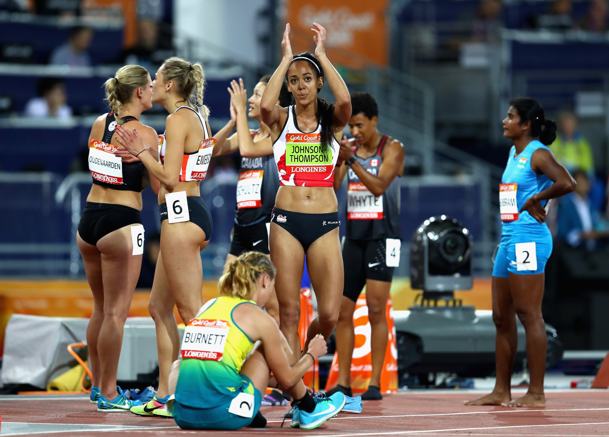 England's Katarina Johnson-Thompson, centre, celebrates with her competitors at the end of the heptathlon ©Getty Images