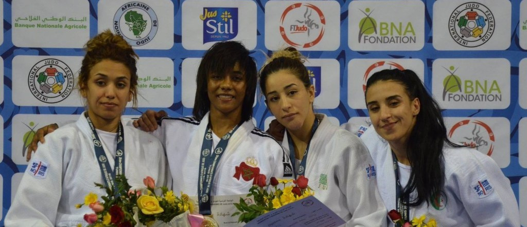 Fatima El Qorachi of Moroco, second left, denied Tunisia's women a hat-trick of wins on day three of the African Judo Championships in Tunis with victor in the under-52kg category ©IJF