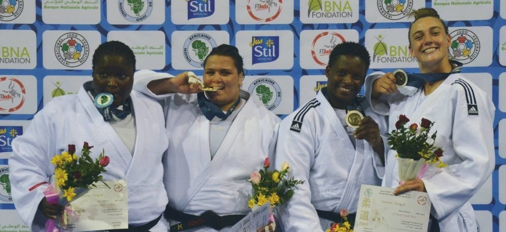 Nihel Cheikh Rouhou. second left, earned one of two home golds on the day at the African Judo Championships in Tunis 