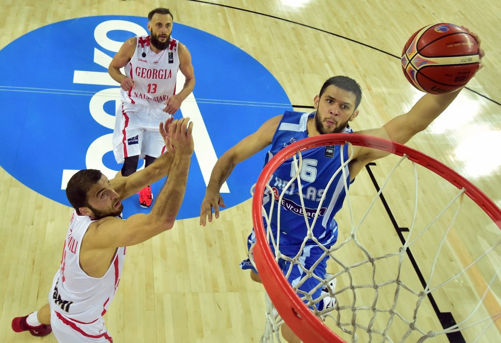 Greece's forward Kostas Papanikolaou goes for the basket past Georgia's forward Manuchar Markoishvili as his country made it three wins from three