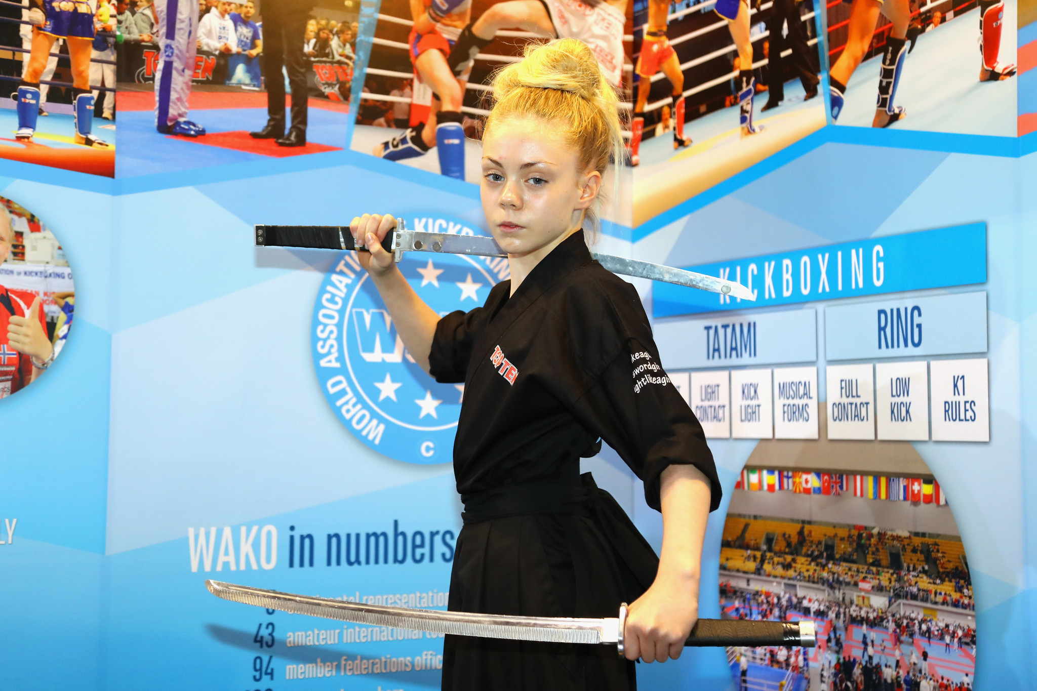 Martial arts star Jesse-Jane McParland poses for a photograph at the World Association of Kickboxing Organizations booth ©Getty Images