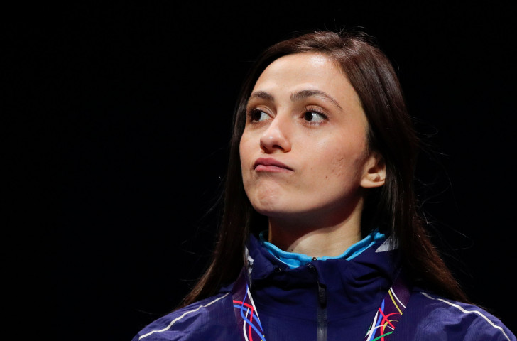 Russian athlete Mariya Lasitskene, who retained her world high jump title last summer as an Authorised Neutral Athlete, reacts on the podium to hearing the IAAF - rather than Russian - anthem being played ©Getty Images