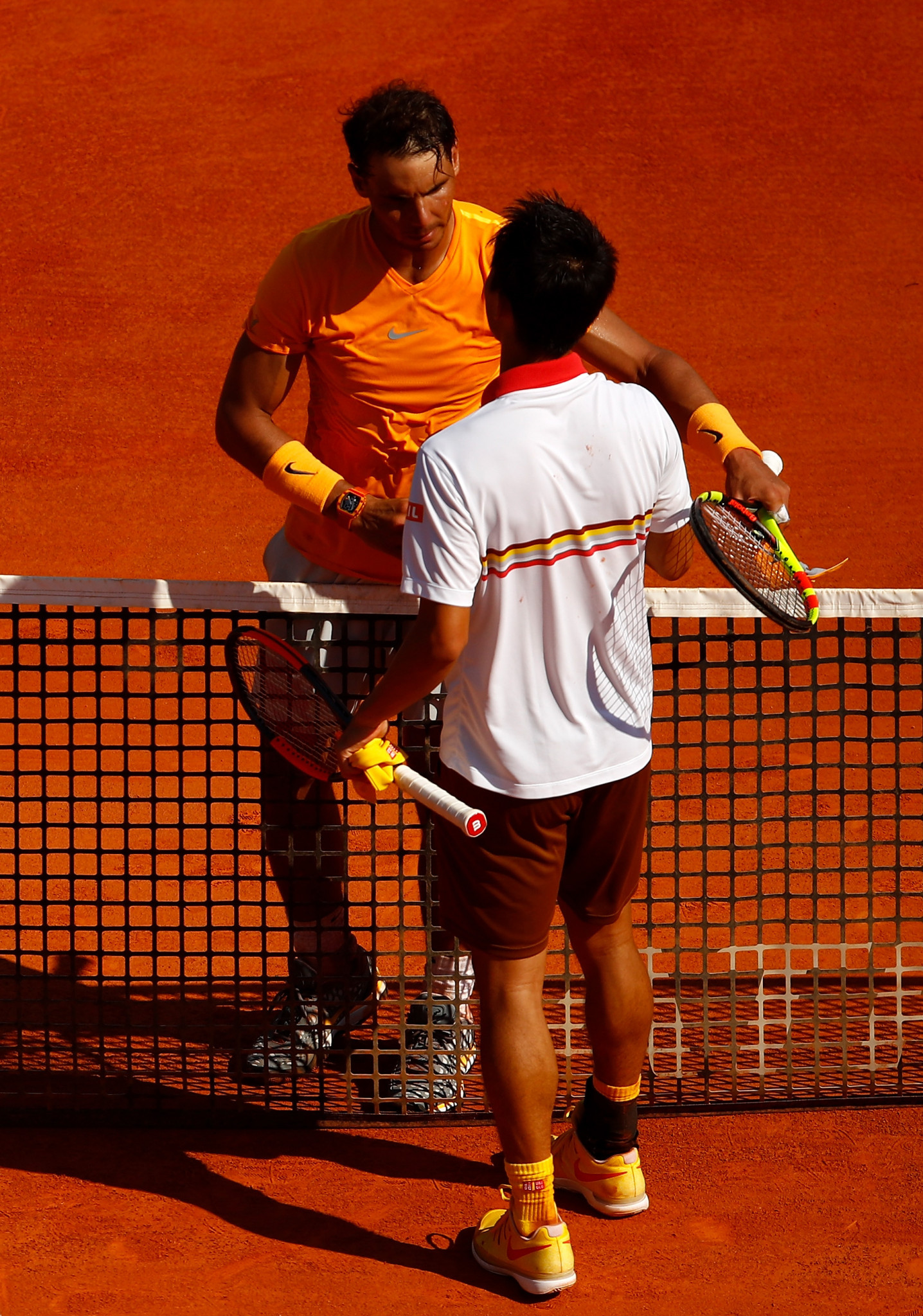 Spain's Rafael Nadal is congratulated by Japan's Kei Nishikori after winning the title at the Monte Carlo Masters and retaining his world number one status ©Getty Images  
