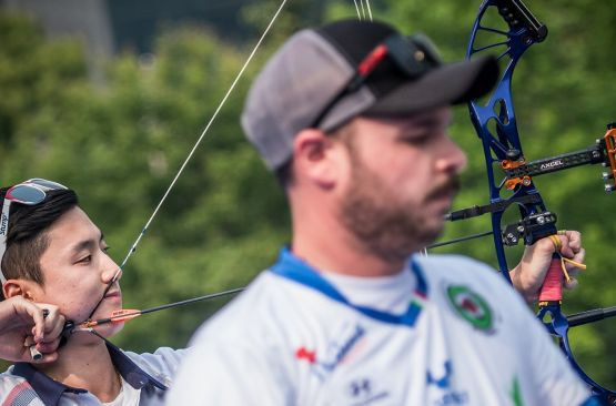 Kim Jongho, pictured, left, in action today at the Shanghai World Archery World Cup, earned an automatic spot at this season's World Cup Final by winning men's individual compound gold ©World Archery  