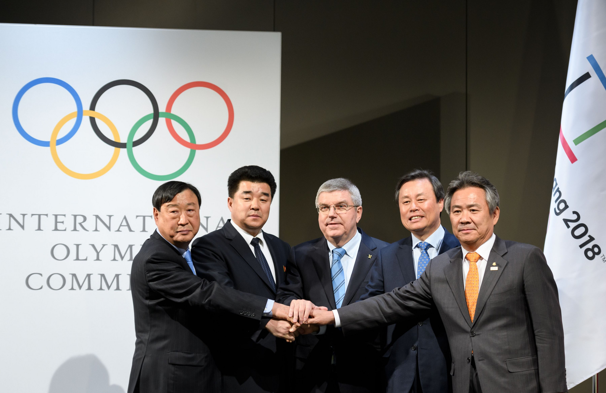 KSOC President President Lee Kee-heung, second right, has cast doubt on the possibility of North and South Korea competing on joint teams at this year's Asian Games ©Getty Images