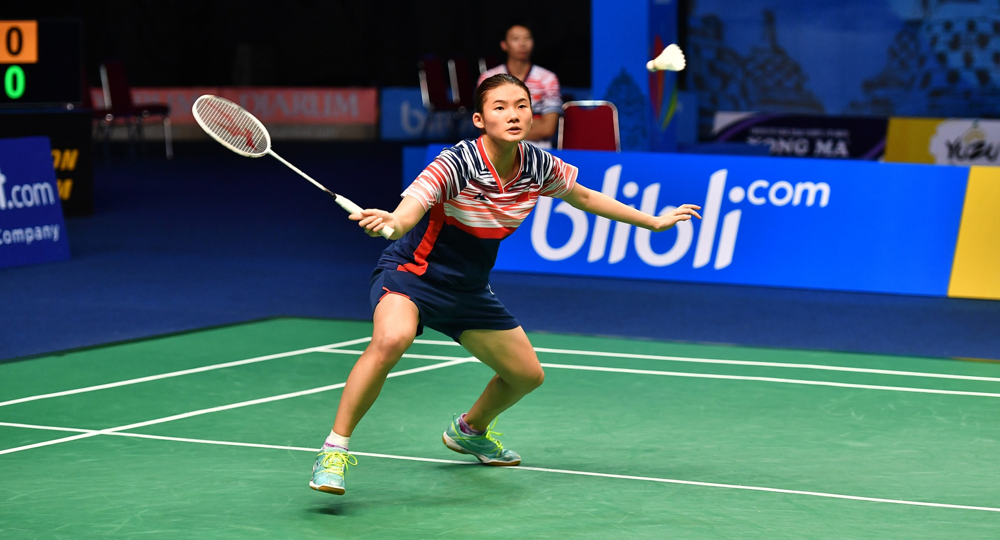 China's Han Yue stunned second seed Michelle Li with a straight games win to book her place in the second round ©BWF