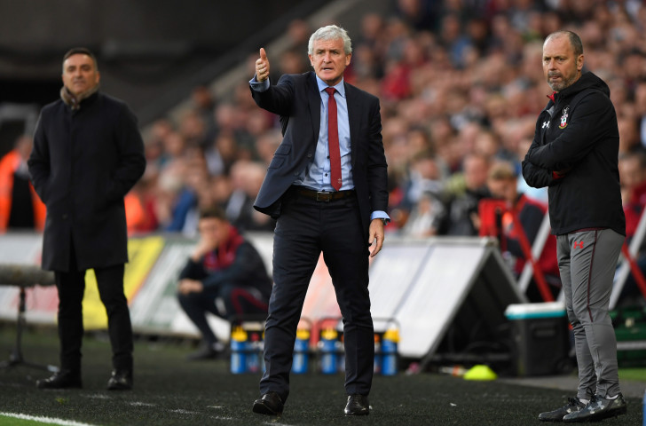 Southampton's manager Mark Hughes, pictured during Tuesday's key relegation-match win at Swansea, has said the last-minute cancellation of his team's hotel booking may have been a case of 