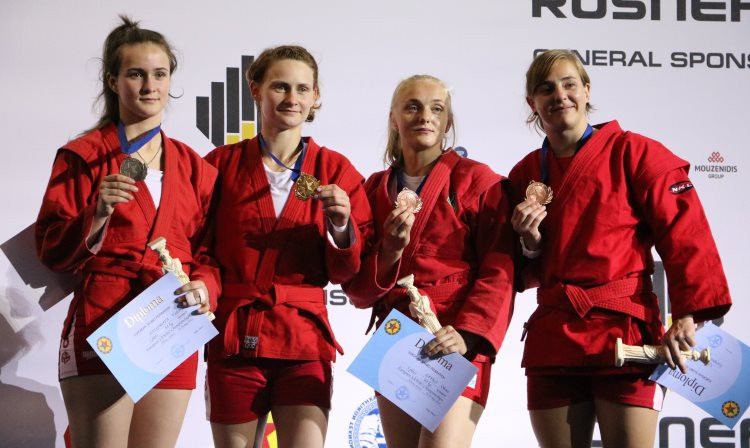 Belarus' Tatsiana Matsko, second from left, was one of nine gold medallists on day two of the 2018 European Sambo Championships in Athens ©FIAS