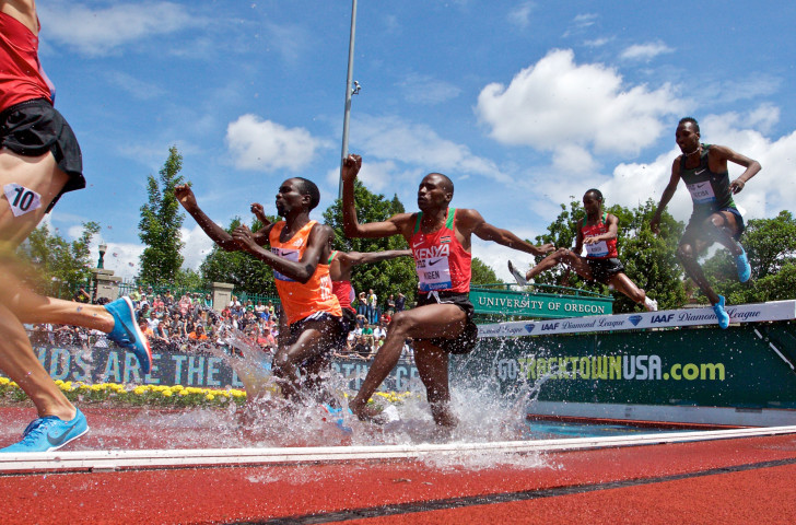 Kenya's Benjamin Kigen, centre, earned a surprise win in the 3,000m steeplechase on the final night of athletics at Hayward Field before it is re-developed ©Getty Images  