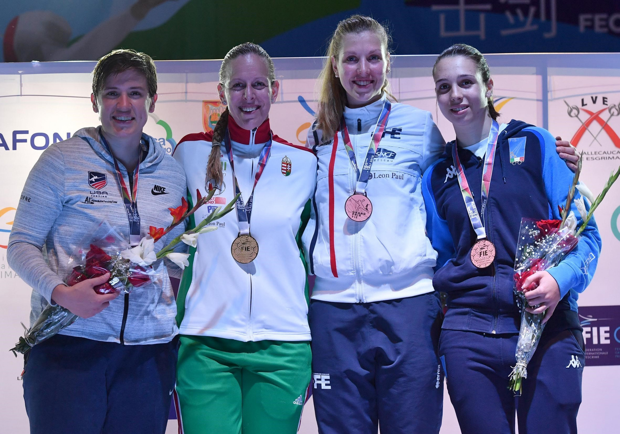 Reigning Olympic champion Emese Szász-Kovács, second from left, won the women's competition ©FIE