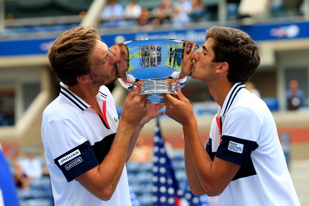 Pierre-Hugues Herbert and Nicolas Mahut celebrate winning the men's doubles title ©Getty Images