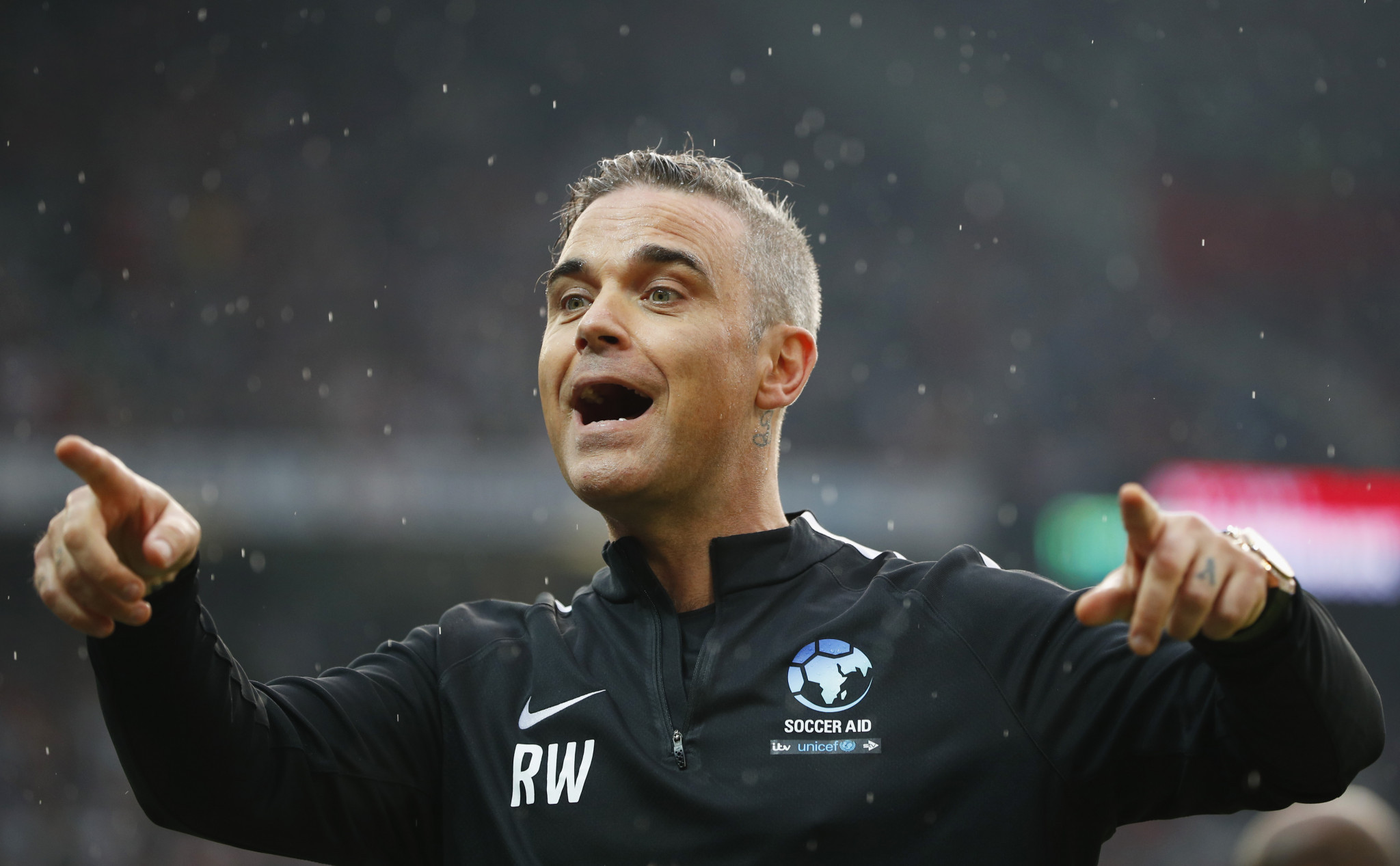 Robbie Williams, pictured playing in a Soccer Aid football match, is due to appear at the Opening Ceremony ©Getty Images
