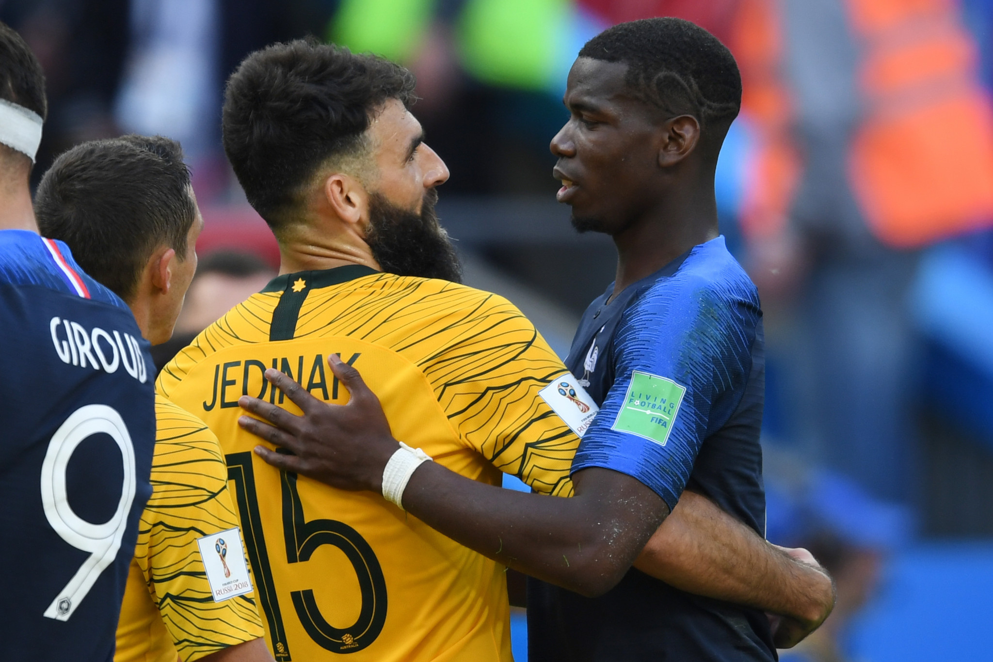 Goalscorers Paul Pogba, right, and Mile Jedinak embrace after the match ©Getty Images 