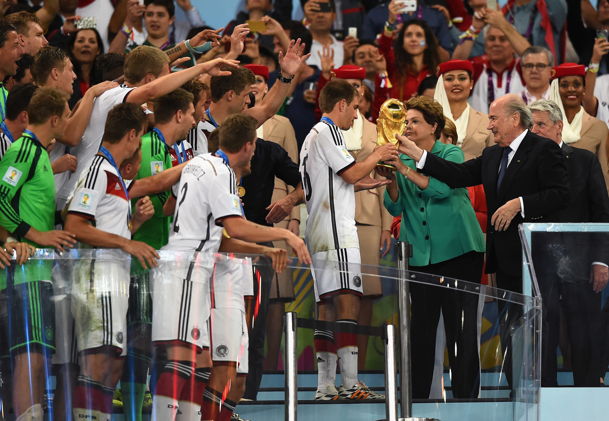 Phillip Lahm is handed the World Cup after Germany's 1-0 final victory over Argentina in 2014 ©Getty Images
