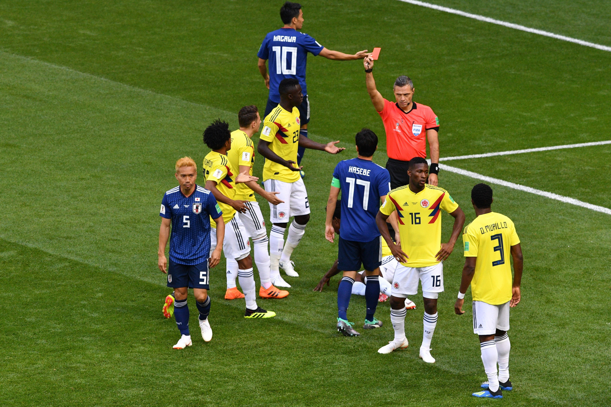 Colombia players protest after Carlos Sanchez is awarded a red card ©Getty Images