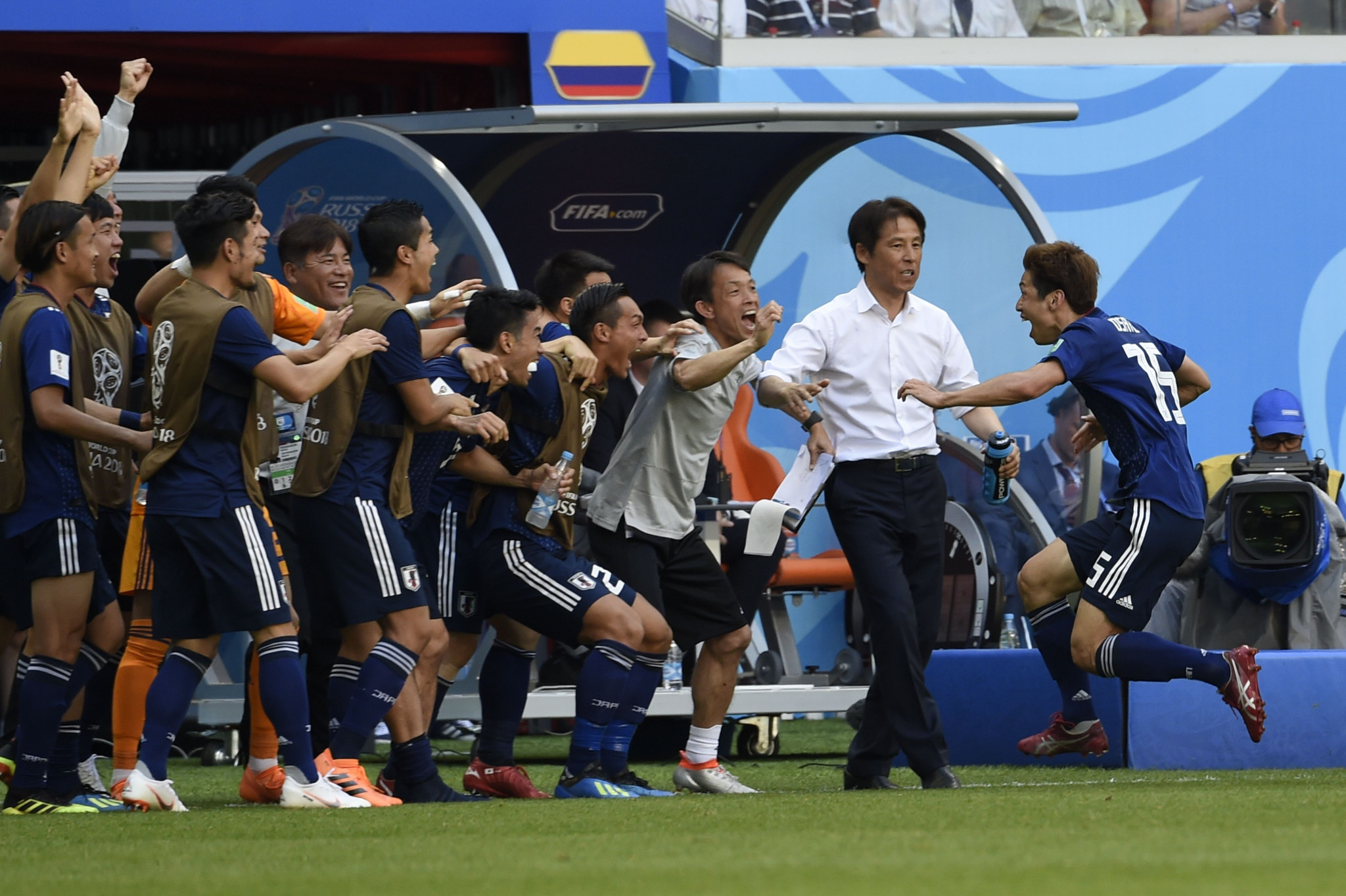 Japanese coaches celebrate their winning goal ©Getty Images