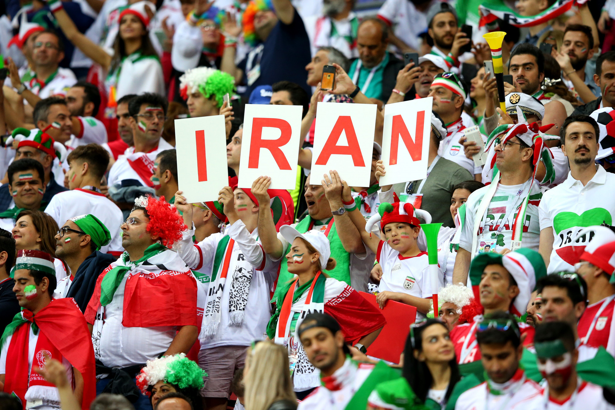 Iran supporters celebrate despite the team being narrowly defeated by Spain ©Getty Images