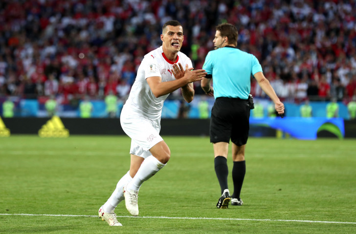 Granit Xhaka makes an Albanian nationalist symbol as he celebrates equalising for Switzerland against Serbia in the FIFA World Cup ©Getty Images  