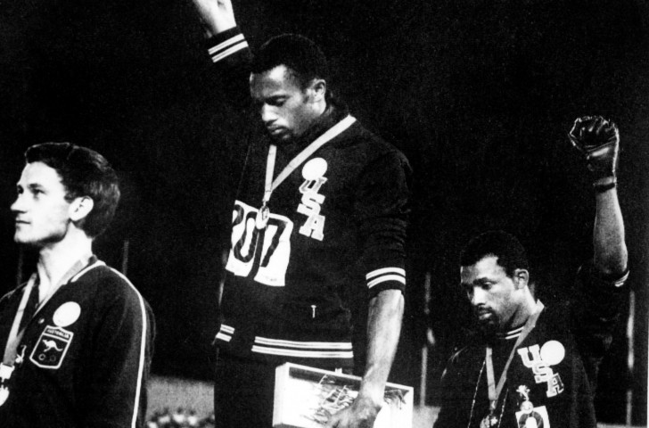 Peter Norman, left, during the medal ceremony for the 1968 Olympic 200m final, where he told Tommie Smith and John Carlos, protesting for human rights: 