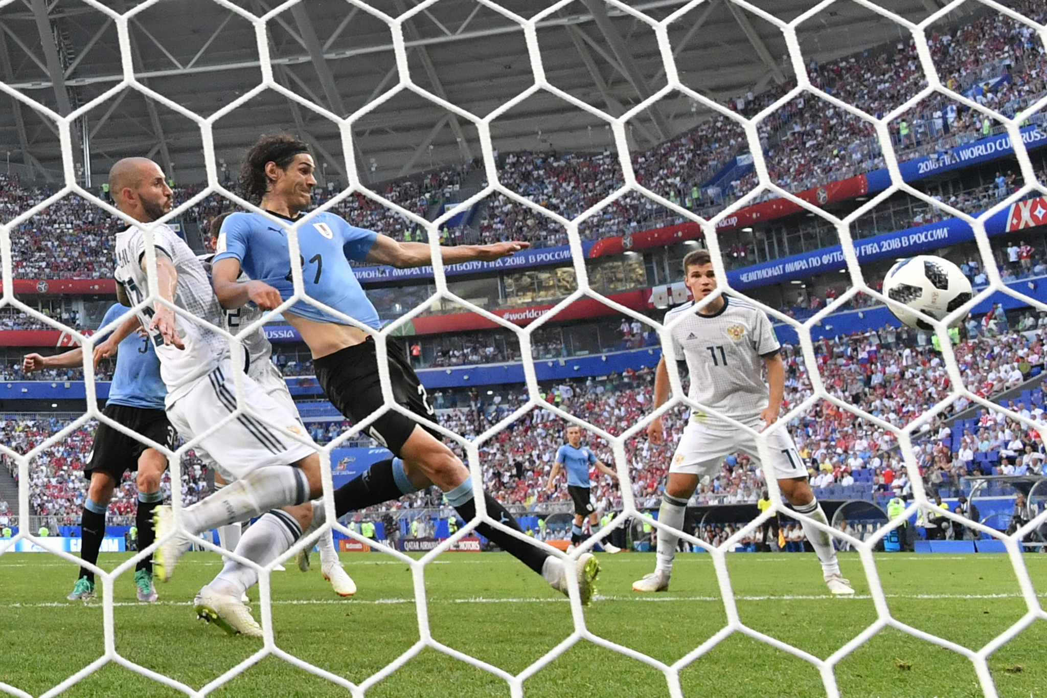 Edinson Cavani was among the scorers as Uruguay finished top of Group A with victory over Russia