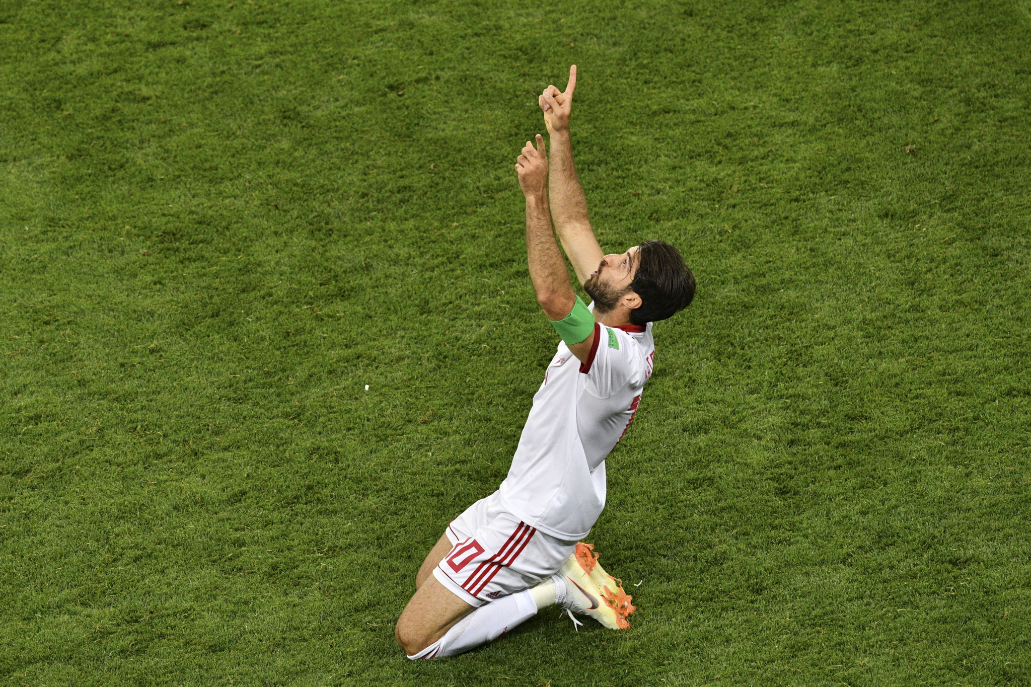 Karim Ansarifard's spot-kick was not enough as Iran were knocked out of the tournament ©Getty Images