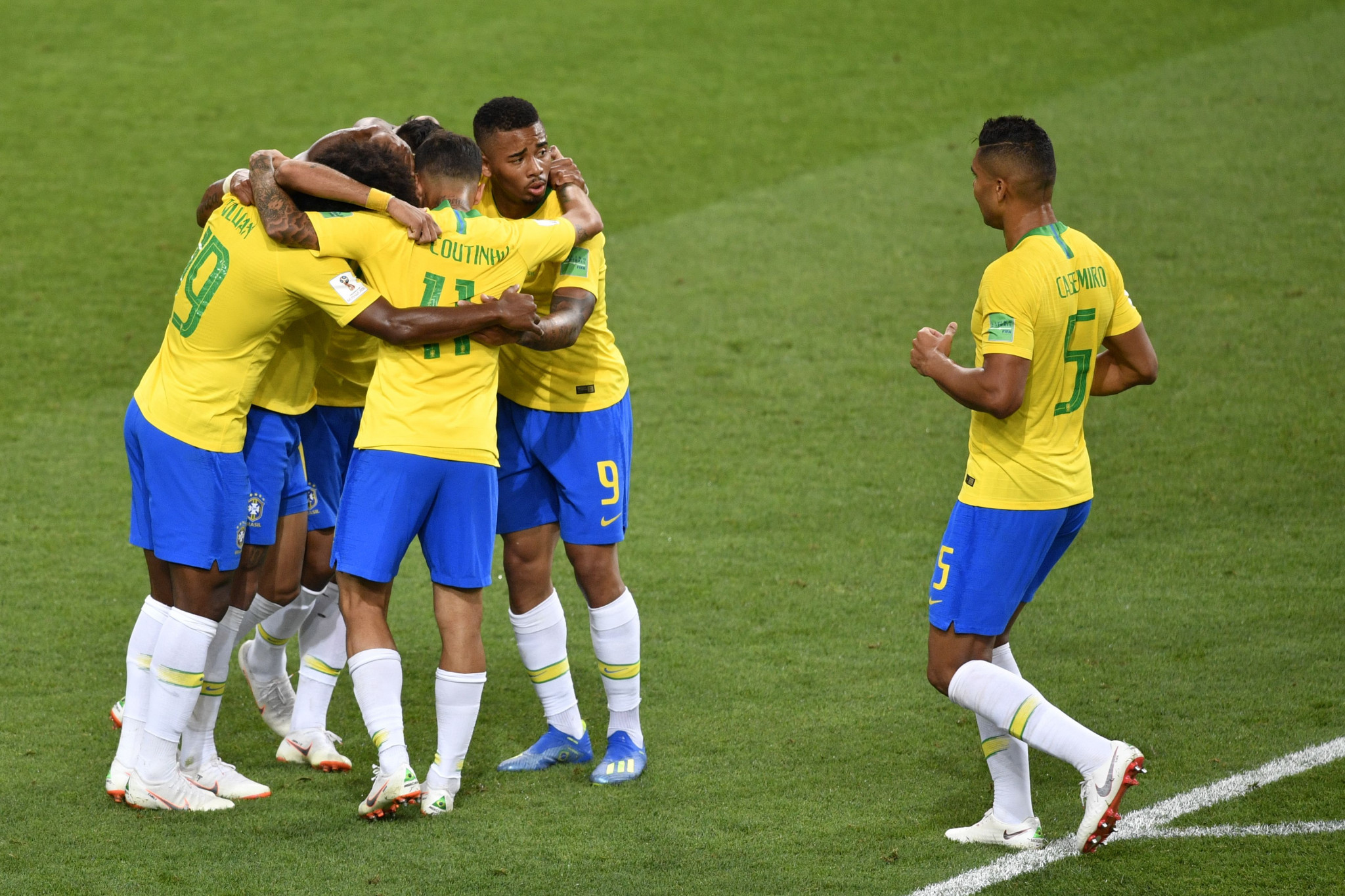 Brazil players celebrate during their 2-0 win over Serbia ©Getty Images