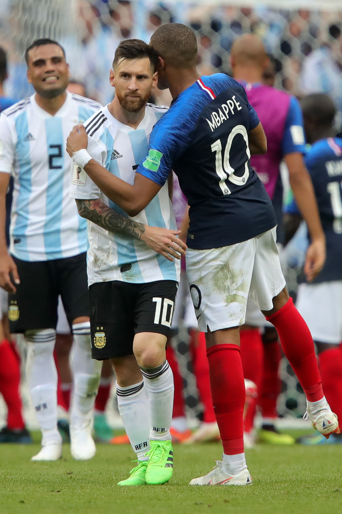 Lionel Messi, left, is commiserated by Kylian Mbappe after a possible changing of the guard ©Getty Images