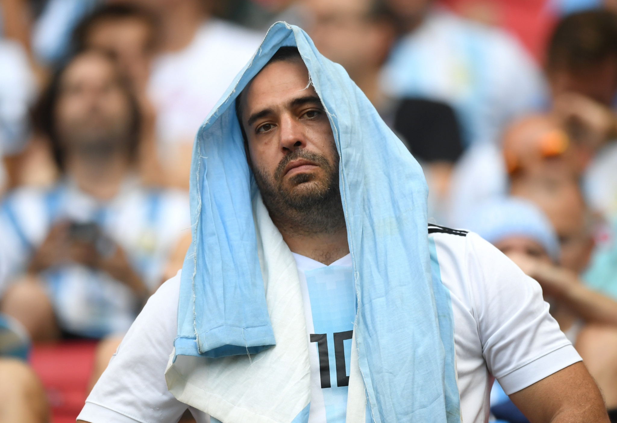 An Argentina fan looks dejected as his team slip to defeat ©Getty Images