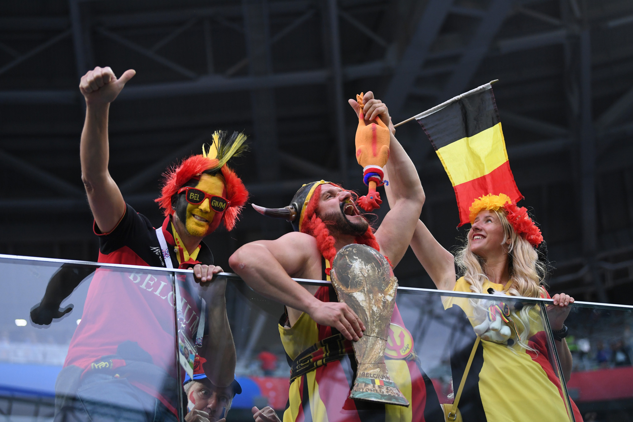 Belgium fans pose with a replica World Cup ©Getty Images