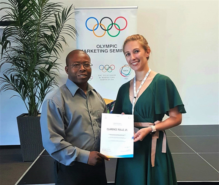 Bahamas Olympic Committee vice-president Clarence Rolle received a certificate from Natascha Trittis, marketing training manager of the IOC’s Television and Marketing Services unit, after the Olympic Marketing Seminar ©BOC