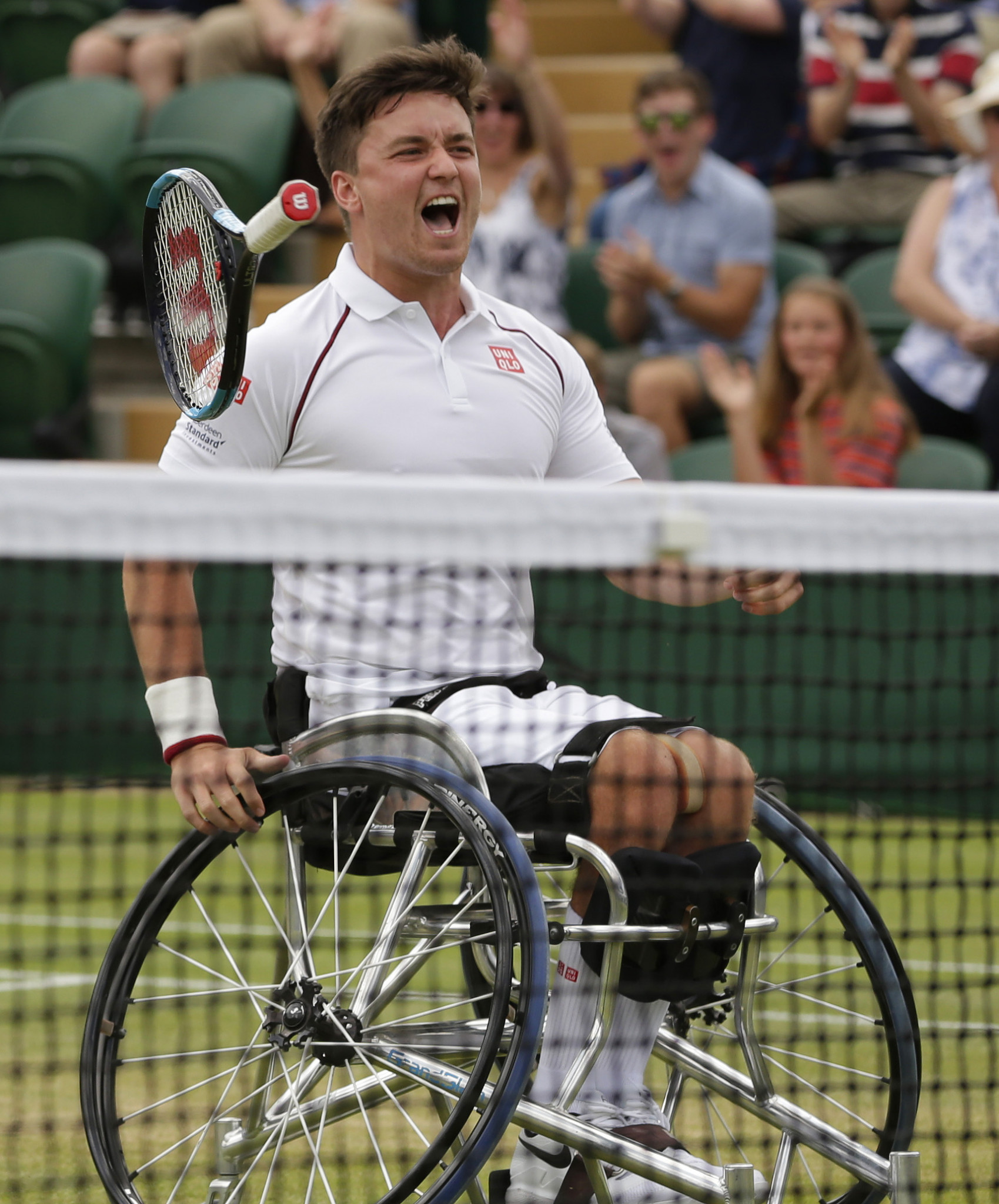 Britain's Gordon Reid celebrates exuberantly as he and Alfie Hewett secure their third successive Wimbledon men's doubles wheelchair title ©Getty Images