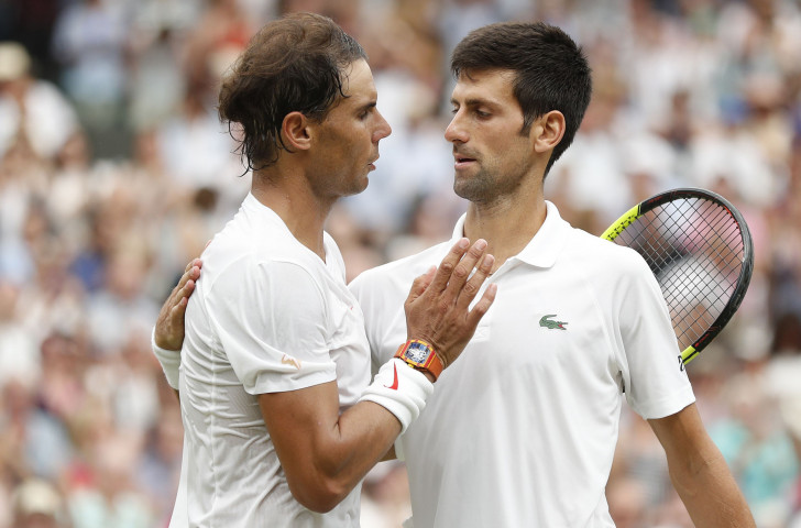 Rafa Nadal, left, congratulates Novak Djokovic after their epic Wimbledon men's singles semi-final ©Getty Images  