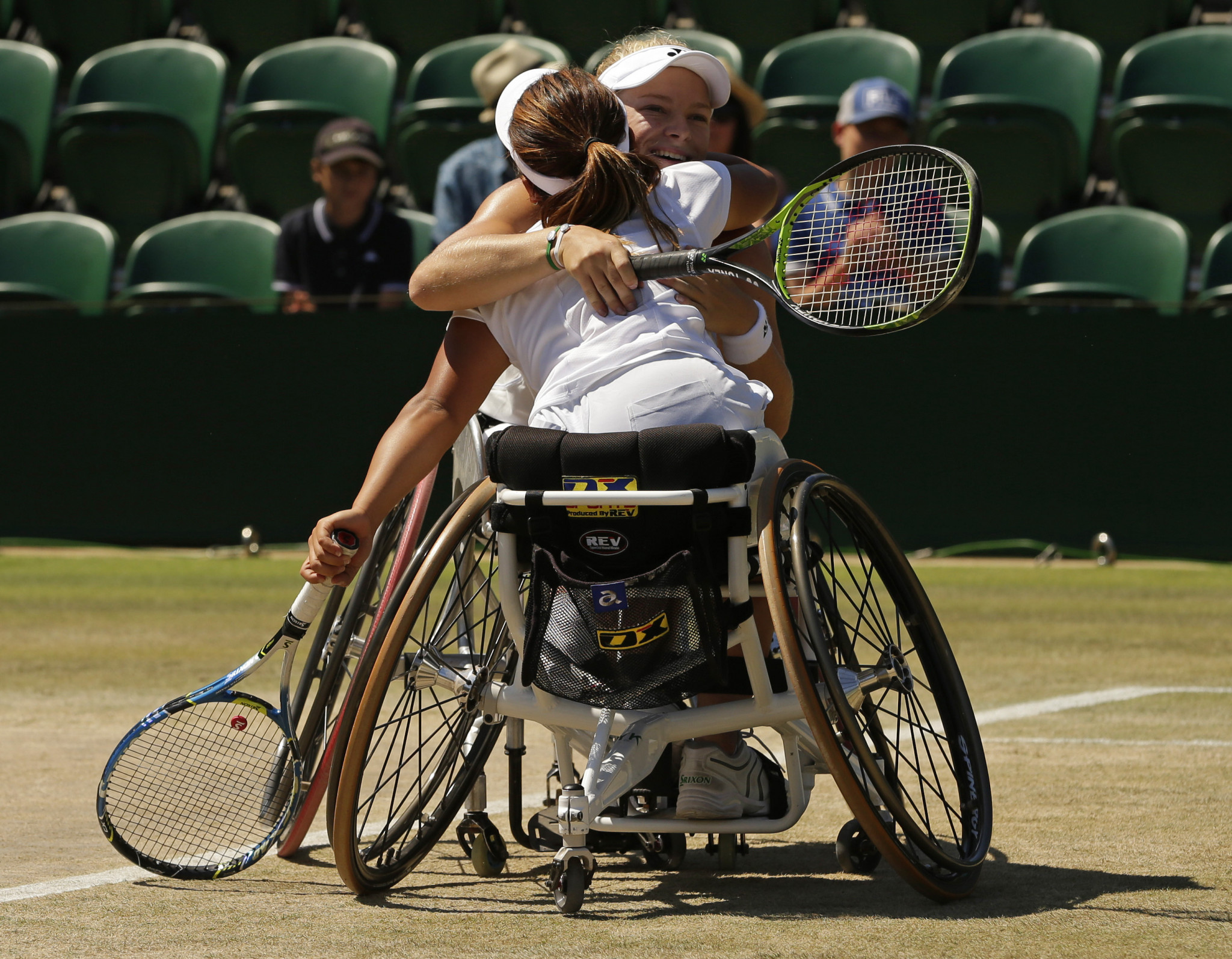 Wimbledon wheelchair singles champion Diede de Groot of The Netherlands celebrates with her partner Yui Kamiji of Japan after they won the women's doubles title ©Getty Images  