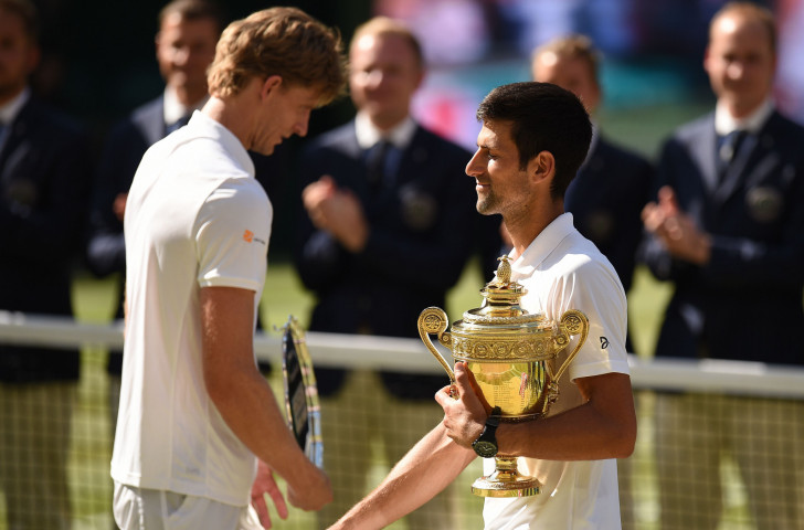 Novak Djokovic savours his first Grand Slam win in two years after his Wimbledon final against South Africa's 6ft 8in Kevin Anderson ©Getty Images  